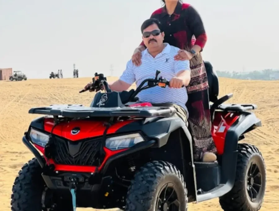 Couple enjoying an ATV quad bike ride on the sand dunes in Osian, Rajasthan
