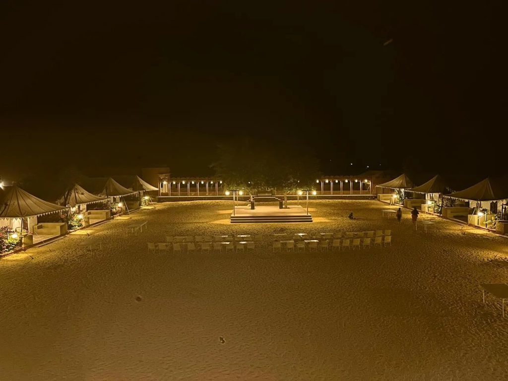 Overnight desert camp tents and seating under the evening sky in Osian, Rajasthan