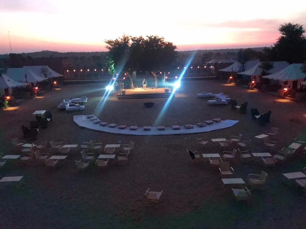 Rajasthani folk dancers and musicians performing around the evening campfire in Osian