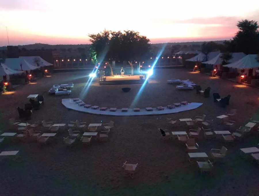 Rajasthani folk dancers and musicians performing around the evening campfire in Osian